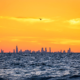 Chicago skyline visible across Lake Michigan from a beach at Indiana Dunes National Park
